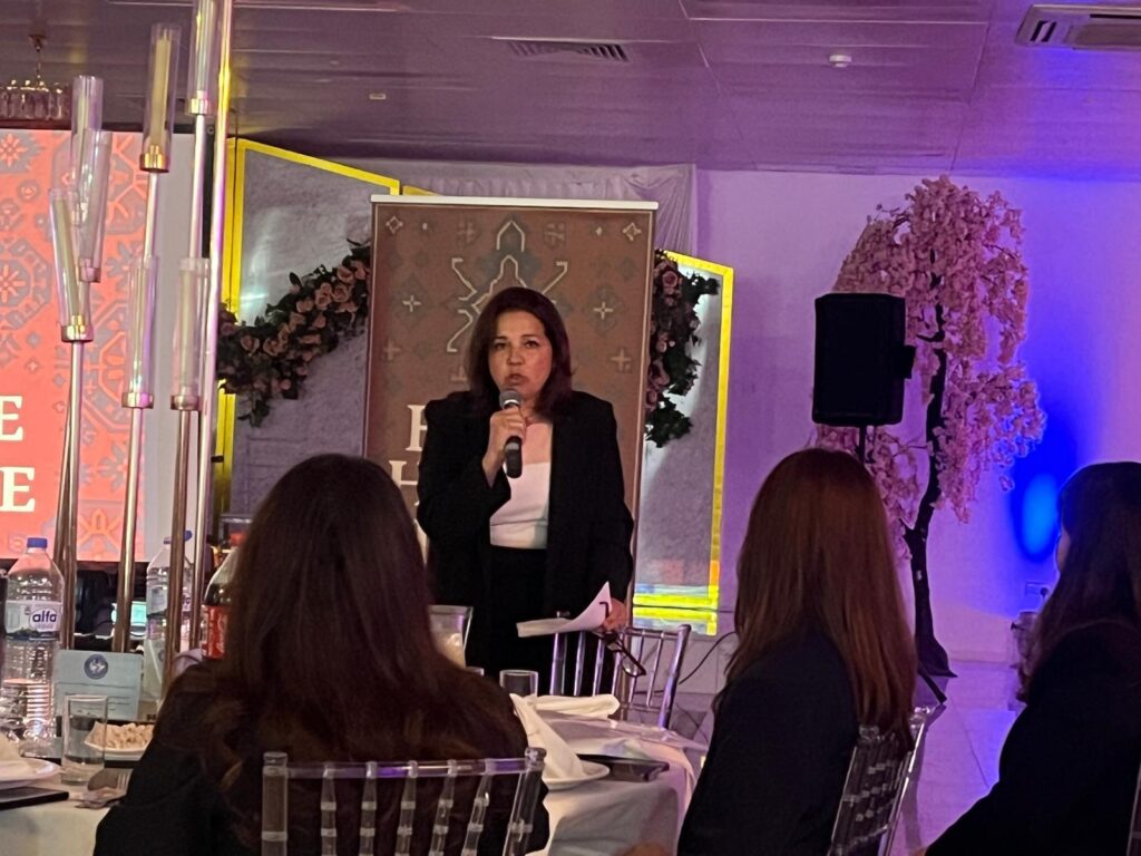 Speaker addressing audience at AAHP-UK event